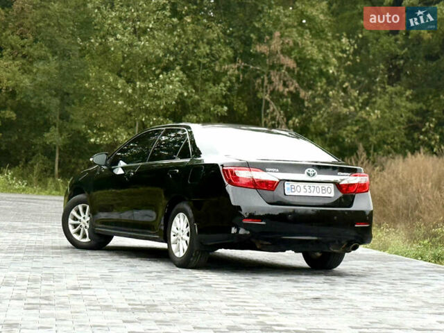 Черный Тойота Камри, объемом двигателя 2.5 л и пробегом 260 тыс. км за 10999 $, фото 24 на Automoto.ua