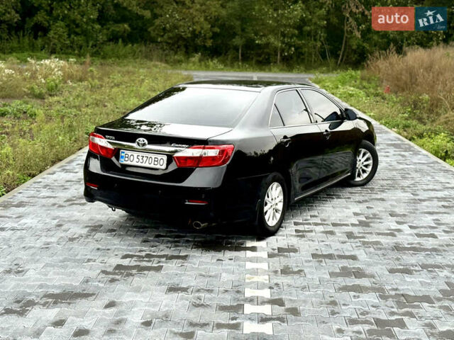 Черный Тойота Камри, объемом двигателя 2.5 л и пробегом 260 тыс. км за 10999 $, фото 26 на Automoto.ua