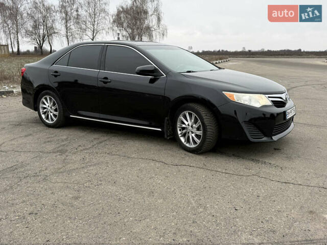 Черный Тойота Камри, объемом двигателя 2.5 л и пробегом 186 тыс. км за 12600 $, фото 2 на Automoto.ua