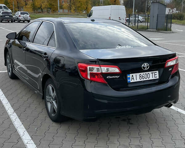 Черный Тойота Камри, объемом двигателя 2.5 л и пробегом 252 тыс. км за 10500 $, фото 5 на Automoto.ua