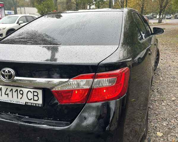 Черный Тойота Камри, объемом двигателя 2.36 л и пробегом 230 тыс. км за 10250 $, фото 12 на Automoto.ua