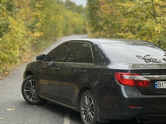 Черный Тойота Камри, объемом двигателя 2.5 л и пробегом 280 тыс. км за 12100 $, фото 2 на Automoto.ua