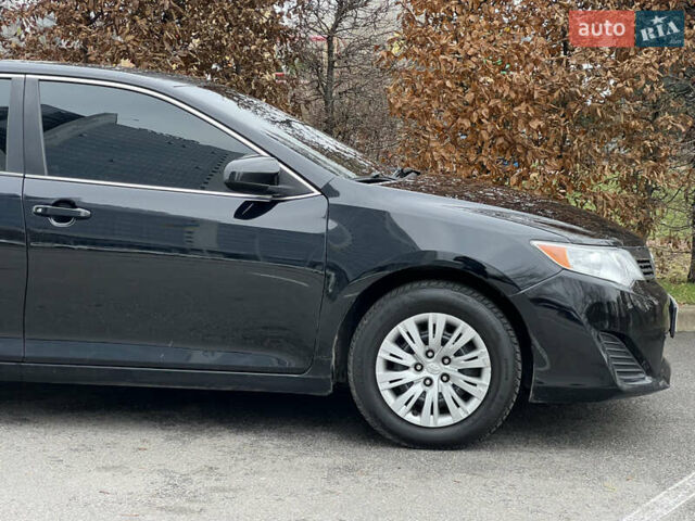 Чорний Тойота Камрі, об'ємом двигуна 2.49 л та пробігом 199 тис. км за 10999 $, фото 25 на Automoto.ua