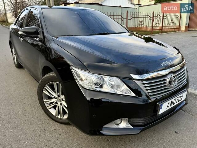 Чорний Тойота Камрі, об'ємом двигуна 2.49 л та пробігом 185 тис. км за 12000 $, фото 18 на Automoto.ua