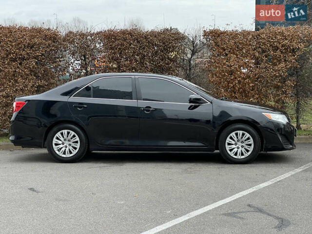 Чорний Тойота Камрі, об'ємом двигуна 2.49 л та пробігом 199 тис. км за 10999 $, фото 23 на Automoto.ua