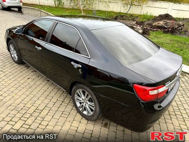 Черный Тойота Камри, объемом двигателя 2.5 л и пробегом 200 тыс. км за 9900 $, фото 2 на Automoto.ua