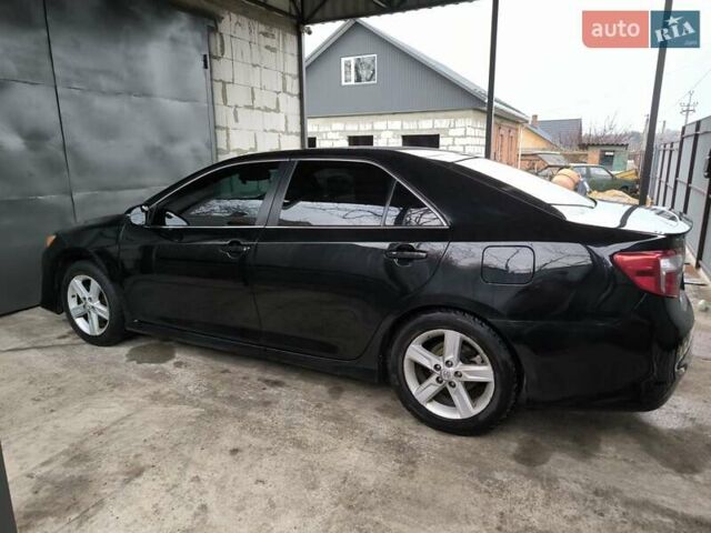 Чорний Тойота Камрі, об'ємом двигуна 2.5 л та пробігом 279 тис. км за 10500 $, фото 3 на Automoto.ua