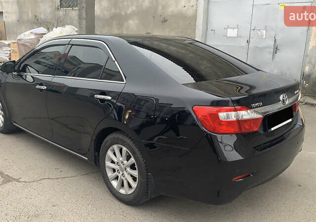Чорний Тойота Камрі, об'ємом двигуна 2.5 л та пробігом 124 тис. км за 14700 $, фото 2 на Automoto.ua