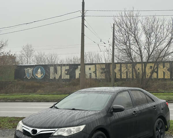 Черный Тойота Камри, объемом двигателя 2.49 л и пробегом 220 тыс. км за 7599 $, фото 1 на Automoto.ua