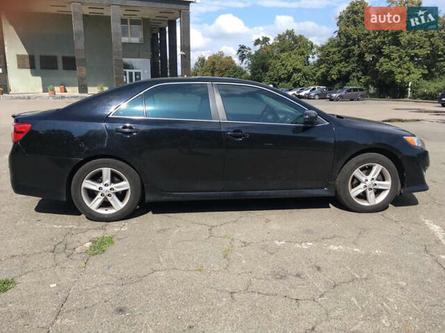 Черный Тойота Камри, объемом двигателя 2.5 л и пробегом 280 тыс. км за 12500 $, фото 2 на Automoto.ua
