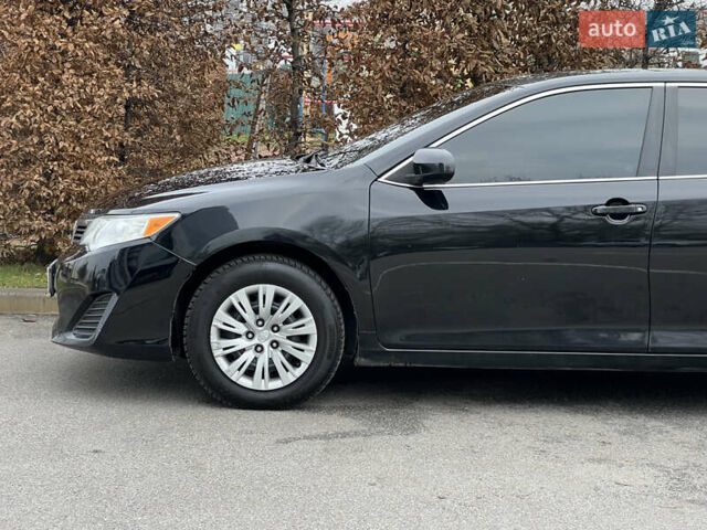 Чорний Тойота Камрі, об'ємом двигуна 2.49 л та пробігом 199 тис. км за 10999 $, фото 11 на Automoto.ua