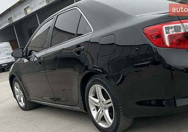 Чорний Тойота Камрі, об'ємом двигуна 2.49 л та пробігом 149 тис. км за 13400 $, фото 1 на Automoto.ua