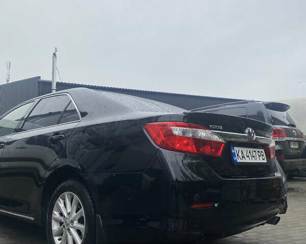 Черный Тойота Камри, объемом двигателя 2.4 л и пробегом 260 тыс. км за 12300 $, фото 2 на Automoto.ua