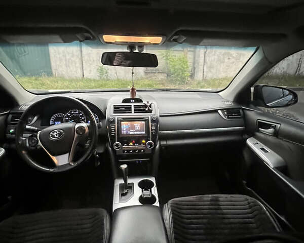 Черный Тойота Камри, объемом двигателя 2.5 л и пробегом 240 тыс. км за 14000 $, фото 19 на Automoto.ua