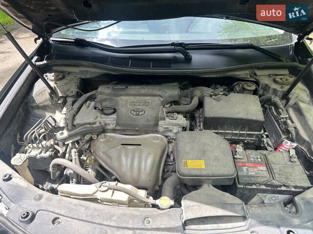 Черный Тойота Камри, объемом двигателя 2.5 л и пробегом 156 тыс. км за 11800 $, фото 1 на Automoto.ua