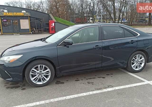 Чорний Тойота Камрі, об'ємом двигуна 2.49 л та пробігом 195 тис. км за 12100 $, фото 1 на Automoto.ua