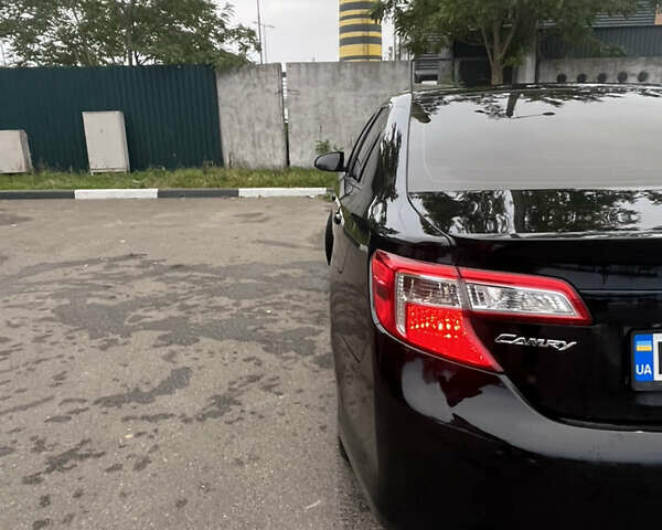 Черный Тойота Камри, объемом двигателя 2.5 л и пробегом 240 тыс. км за 14000 $, фото 13 на Automoto.ua