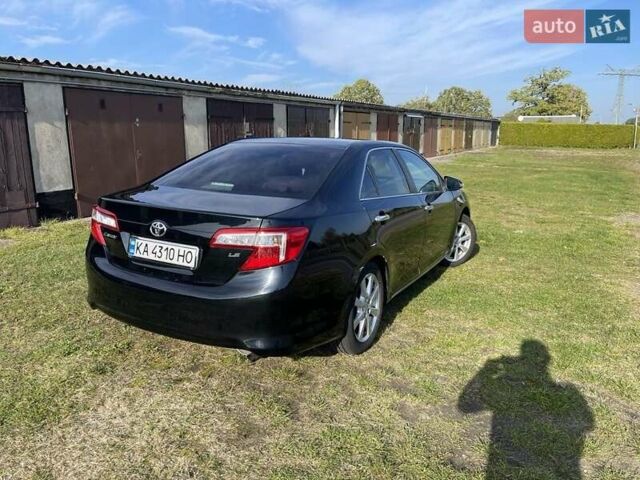Черный Тойота Камри, объемом двигателя 2.5 л и пробегом 130 тыс. км за 11500 $, фото 1 на Automoto.ua