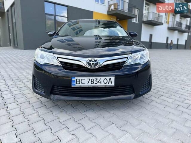 Черный Тойота Камри, объемом двигателя 2.49 л и пробегом 195 тыс. км за 11250 $, фото 1 на Automoto.ua