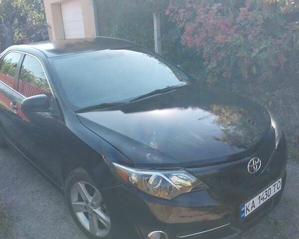 Черный Тойота Камри, объемом двигателя 2.5 л и пробегом 130 тыс. км за 12100 $, фото 1 на Automoto.ua