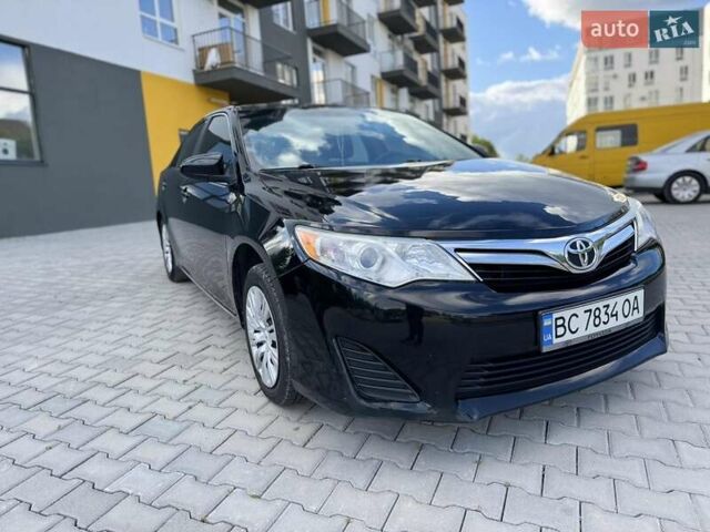 Черный Тойота Камри, объемом двигателя 2.49 л и пробегом 195 тыс. км за 11250 $, фото 2 на Automoto.ua
