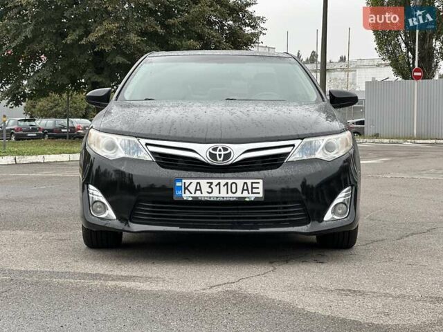 Черный Тойота Камри, объемом двигателя 2.49 л и пробегом 220 тыс. км за 12800 $, фото 1 на Automoto.ua