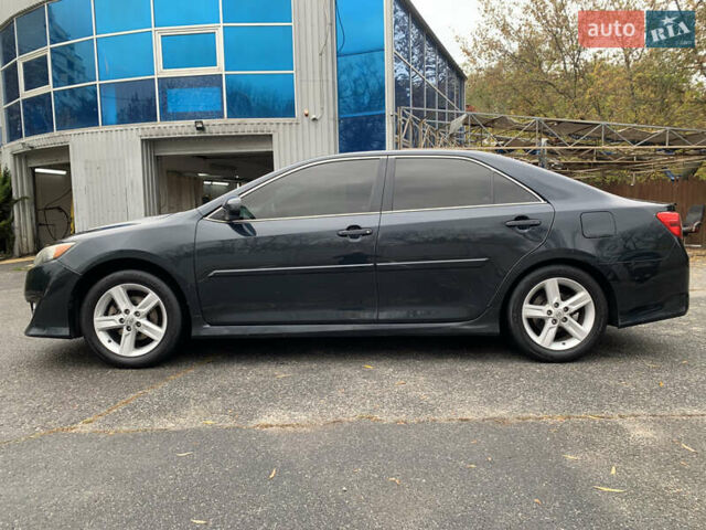 Черный Тойота Камри, объемом двигателя 2.49 л и пробегом 198 тыс. км за 11300 $, фото 2 на Automoto.ua