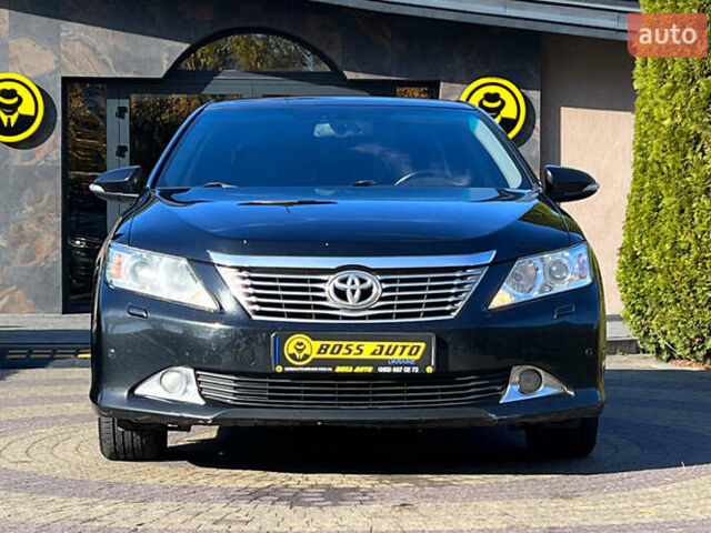 Черный Тойота Камри, объемом двигателя 2.49 л и пробегом 260 тыс. км за 13750 $, фото 1 на Automoto.ua