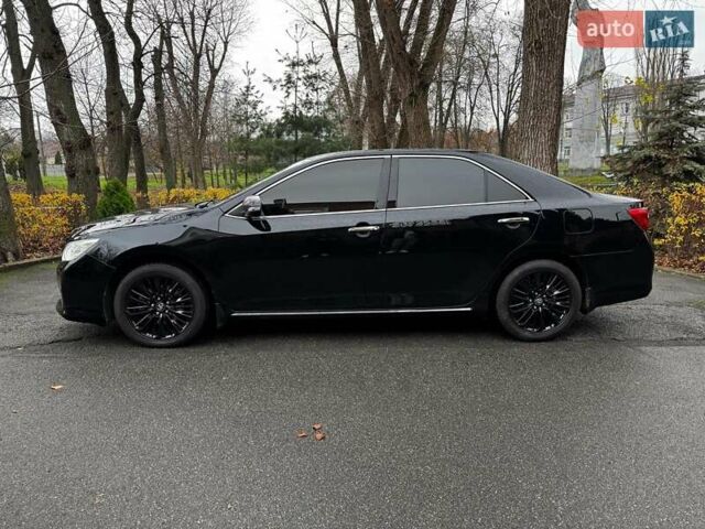 Черный Тойота Камри, объемом двигателя 2.5 л и пробегом 257 тыс. км за 13990 $, фото 13 на Automoto.ua