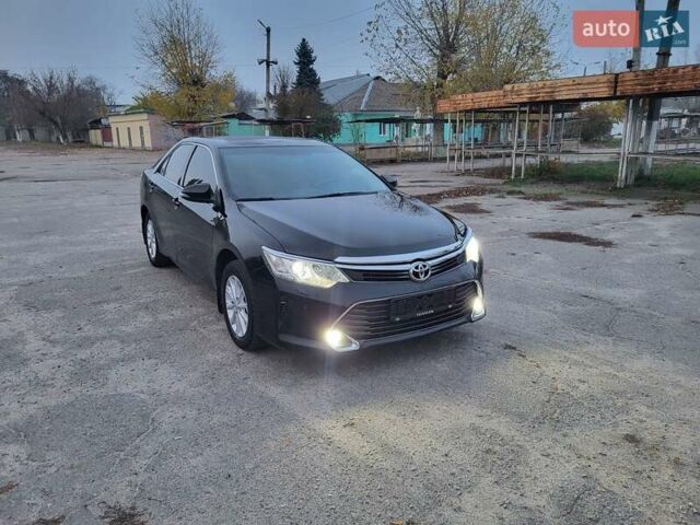 Черный Тойота Камри, объемом двигателя 2.5 л и пробегом 183 тыс. км за 14900 $, фото 1 на Automoto.ua