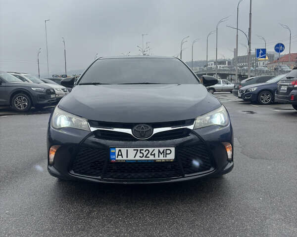 Черный Тойота Камри, объемом двигателя 2.5 л и пробегом 143 тыс. км за 12900 $, фото 1 на Automoto.ua