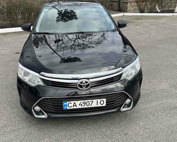 Черный Тойота Камри, объемом двигателя 2.49 л и пробегом 260 тыс. км за 16500 $, фото 1 на Automoto.ua