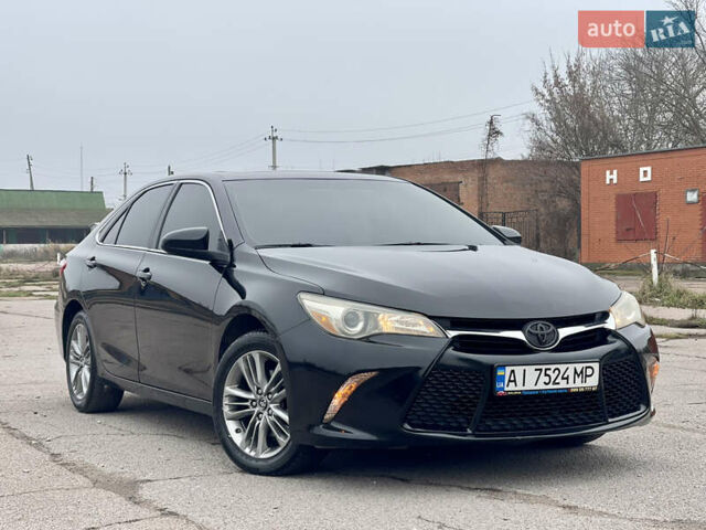 Черный Тойота Камри, объемом двигателя 2.49 л и пробегом 145 тыс. км за 11999 $, фото 1 на Automoto.ua