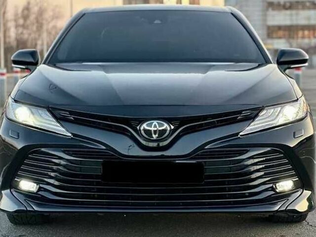 Черный Тойота Камри, объемом двигателя 2.5 л и пробегом 105 тыс. км за 16200 $, фото 1 на Automoto.ua