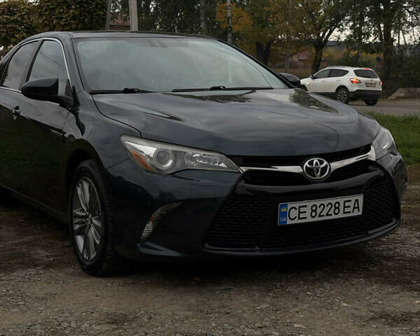 Чорний Тойота Камрі, об'ємом двигуна 2.49 л та пробігом 176 тис. км за 14500 $, фото 1 на Automoto.ua
