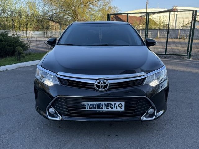 Черный Тойота Камри, объемом двигателя 2.5 л и пробегом 133 тыс. км за 18700 $, фото 1 на Automoto.ua