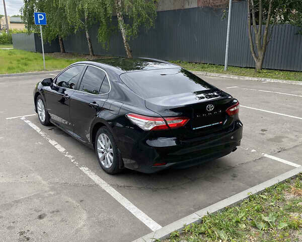 Черный Тойота Камри, объемом двигателя 2.49 л и пробегом 166 тыс. км за 18000 $, фото 1 на Automoto.ua