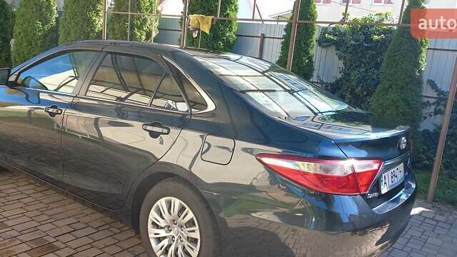Чорний Тойота Камрі, об'ємом двигуна 2.49 л та пробігом 240 тис. км за 12000 $, фото 2 на Automoto.ua