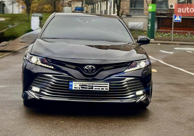 Черный Тойота Камри, объемом двигателя 2.5 л и пробегом 77 тыс. км за 25600 $, фото 1 на Automoto.ua