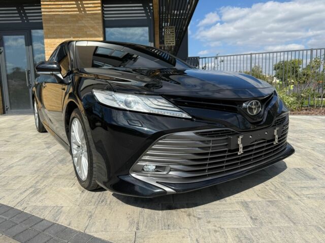 Черный Тойота Камри, объемом двигателя 2.5 л и пробегом 100 тыс. км за 23000 $, фото 1 на Automoto.ua