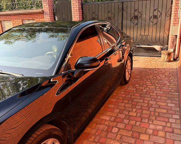 Черный Тойота Камри, объемом двигателя 2.49 л и пробегом 260 тыс. км за 19400 $, фото 1 на Automoto.ua