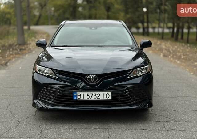 Чорний Тойота Камрі, об'ємом двигуна 2.5 л та пробігом 64 тис. км за 19300 $, фото 1 на Automoto.ua