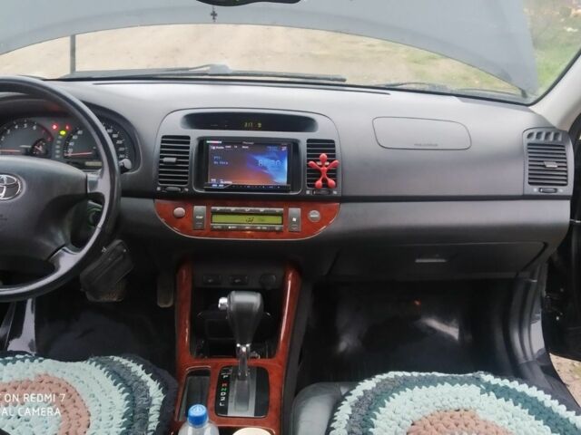 Черный Тойота Камри, объемом двигателя 2.4 л и пробегом 290 тыс. км за 7000 $, фото 6 на Automoto.ua