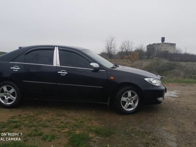 Черный Тойота Камри, объемом двигателя 2.4 л и пробегом 290 тыс. км за 7000 $, фото 2 на Automoto.ua