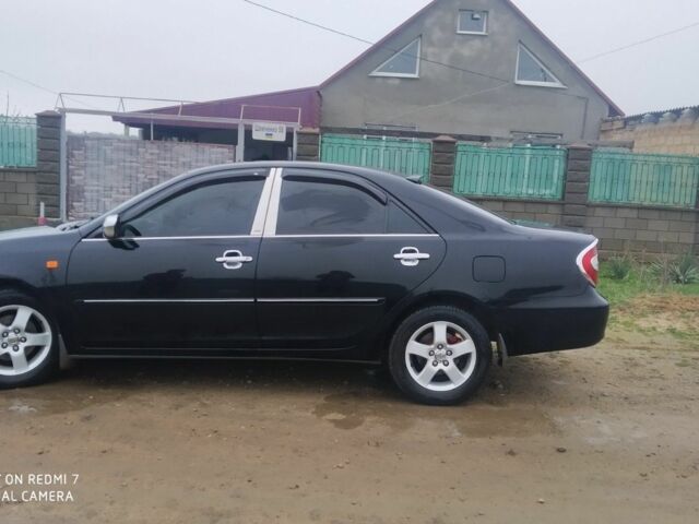 Черный Тойота Камри, объемом двигателя 2.4 л и пробегом 290 тыс. км за 7000 $, фото 4 на Automoto.ua