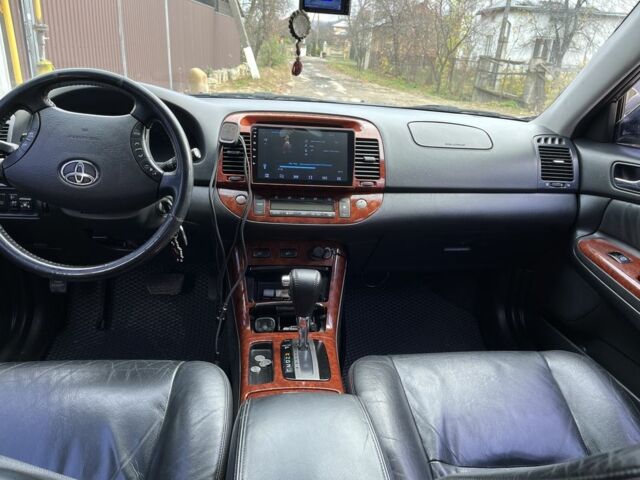 Черный Тойота Камри, объемом двигателя 2.4 л и пробегом 250 тыс. км за 6500 $, фото 21 на Automoto.ua