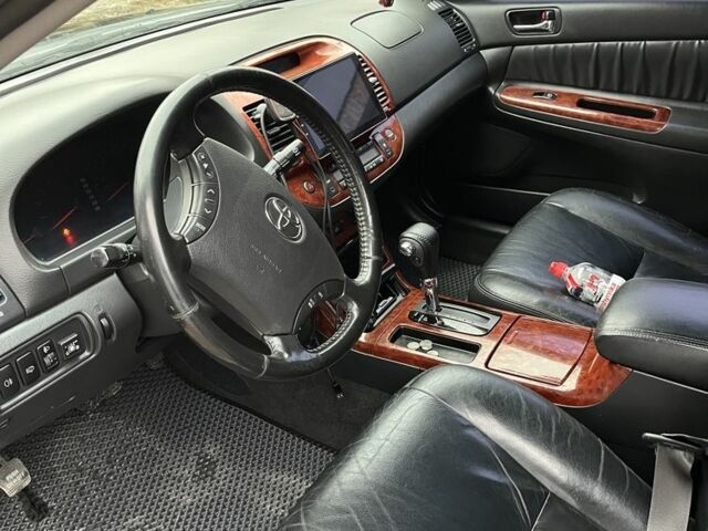 Черный Тойота Камри, объемом двигателя 2.4 л и пробегом 250 тыс. км за 6500 $, фото 4 на Automoto.ua