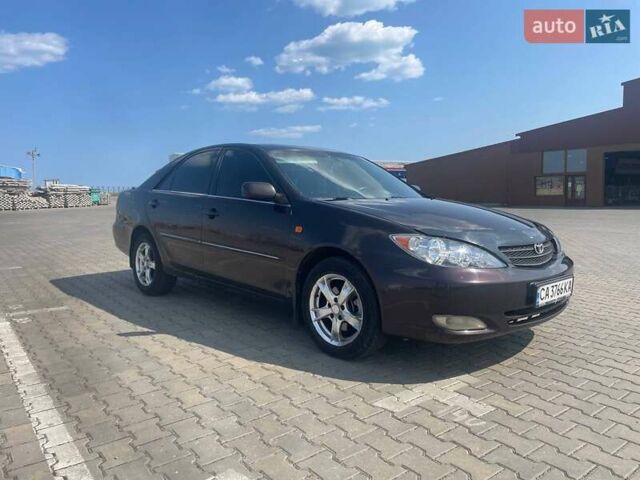 Коричневий Тойота Камрі, об'ємом двигуна 2.4 л та пробігом 320 тис. км за 4700 $, фото 1 на Automoto.ua