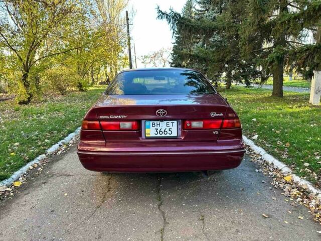 Красный Тойота Камри, объемом двигателя 3 л и пробегом 340 тыс. км за 2950 $, фото 4 на Automoto.ua