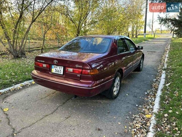 Червоний Тойота Камрі, об'ємом двигуна 3 л та пробігом 340 тис. км за 2950 $, фото 3 на Automoto.ua